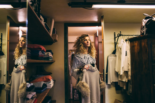 Blonde woman coming out of the fitting room