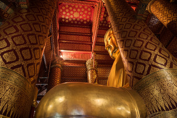 Big gold buddha statue in the Phana Choeng temple in Ayutthaya, Thailand.