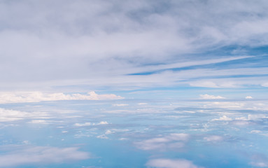 the view of blue sky and white cloud from the airplane window