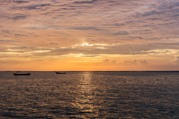 Sunset sky and sea nice clound boat fisher in the sea.