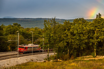 Beautiful train under the rainbow