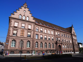 Fototapeta na wymiar Basel, representative historical building and people on square in Switzerland