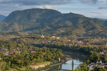 Naklejka premium Top view of Luang Prabang from Phousi Mountain during sunset.