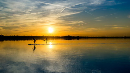 Fototapeta na wymiar Stand up paddle, summer sunset