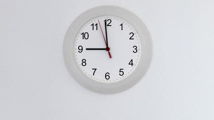 clock on wall showing nine hours