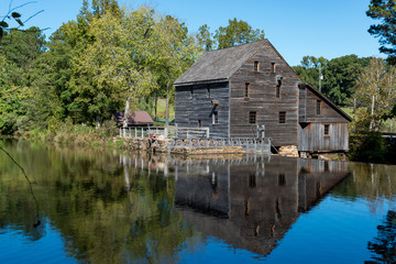 Fototapeta na wymiar Mill overlooking pond and dam