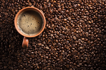 coffee cup on coffee beans background