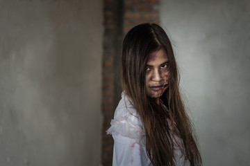 Fototapeta premium Portrait Zombie woman with bloody