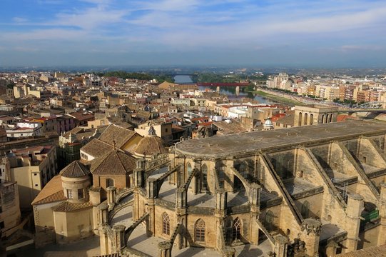 Tortosa, Catalonia, Spain skyline from above with Cathedral of Saint Mary and River Ebro on horizon