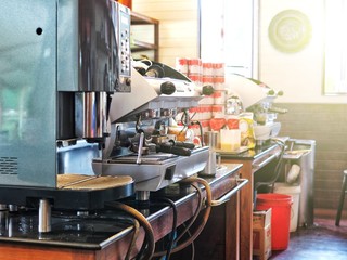 Coffee machine on the busy counter bar in cafe.