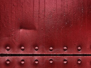 Red metal plate background.