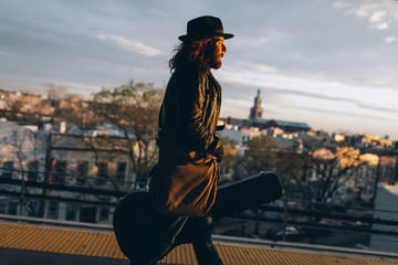 Musician waiting on the subway platform