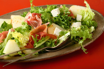 salad with prosciutto and melon slice