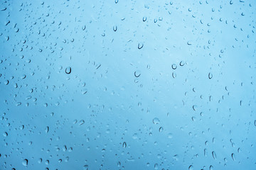 Raindrops, water drop, steam shower, on window in cool tone that show texture, detail, can used as graphic resource, wallpaper, background