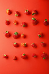 Fresh strawberries on red