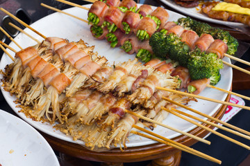 Tasty deliciuos grilled cut sausage wrap with bacon