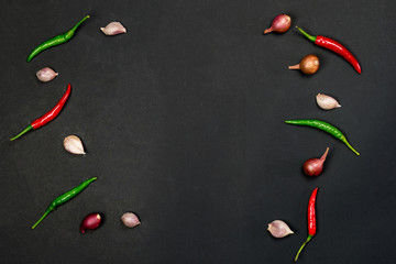 Red chilli and garlic on black table background ,include copyspace for add your text or graphic