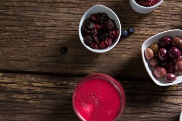 Fruits and juice on wooden table