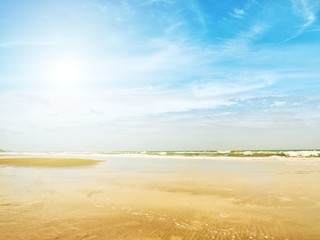 Landscape scene of beautiful tropical sea with clean beach and blue sky on sunny day. Concept for holiday and vacation.