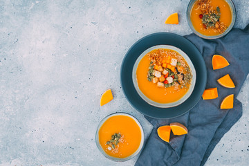 Fototapeta na wymiar Pumpkin soup with pumpkin seeds in bowl