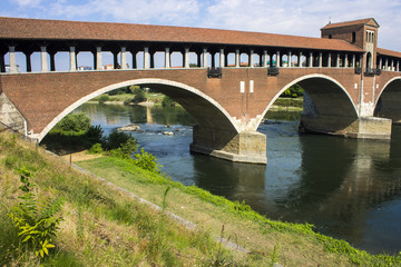 The Ponte Coperto (covered bridge), also known as the Ponte Vecchio (old bridge), a brick and stone arch bridge over the Ticino River in Pavia, Italy