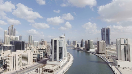 Obraz premium DUBAI, UAE - DECEMBER 2016: Aerial view of Downtown Dubai at sunset. The city attracts 20 million people annually