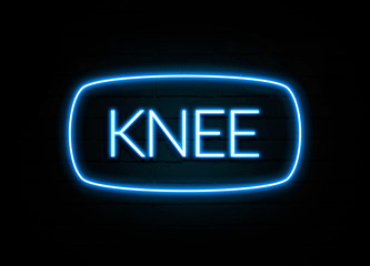 Knee  - colorful Neon Sign on brickwall