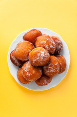 round jelly doughnut sufganiyah for Hanukkah, Jewish holiday commemorating the rededication of the Holy Temple