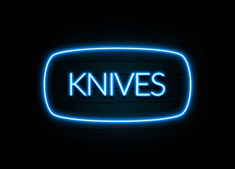 Knives  - colorful Neon Sign on brickwall