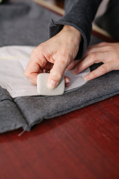 Young woman designer working in atelier