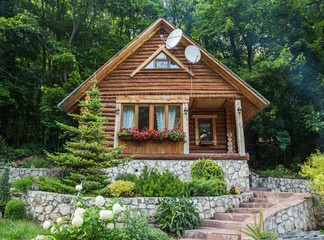 Cottage from logs in the forest