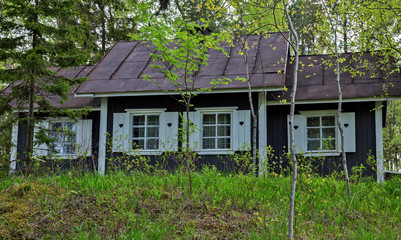 Landscape with a cottage in the park