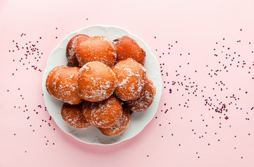 round jelly doughnut sufganiyah for Hanukkah, Jewish holiday commemorating the rededication of the Holy Temple