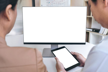 Business people conference, Two confident executive colleagues meeting and discussing, working in business strategy and financial plan to investment profit on digital tablet