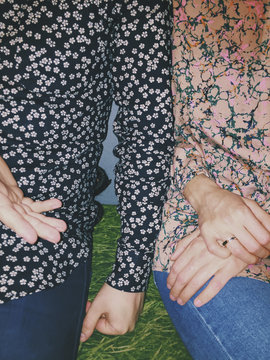 Two friends with funky shirts conversing