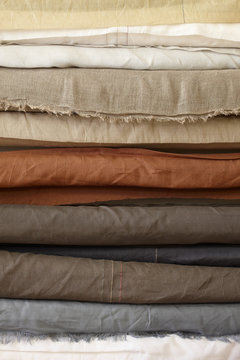 Exposed rolls of different fabric and colour
