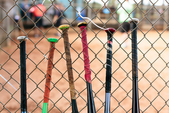 Baseball bats on the fence