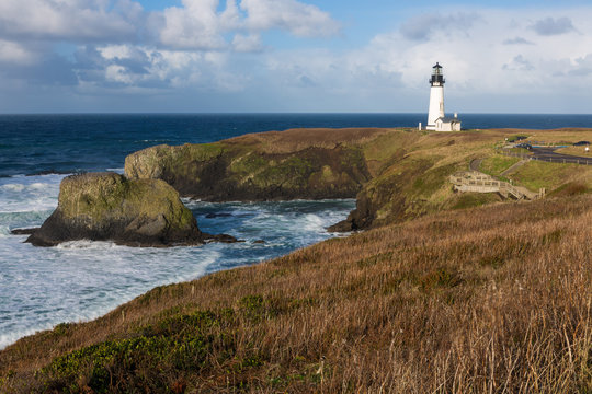 Afternoon clouds roll over Yaquina Head Lighthouse on the Oregon Coast