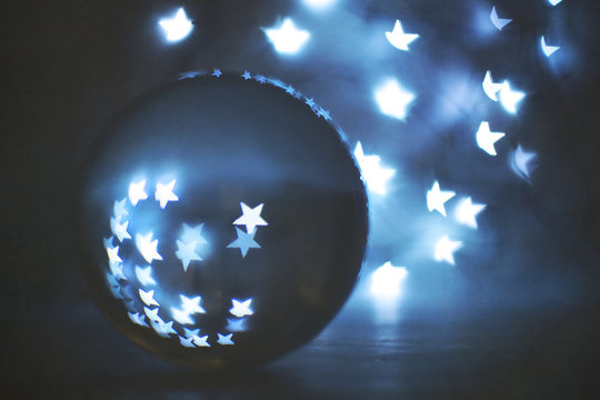 View of crystal ball against blue background