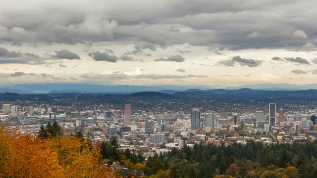 Time lapse video of stormy clouds and sky over Portland Oregon downtown cityscape in beautiful Pacific Northwest colorful fall season 4k ultra hd