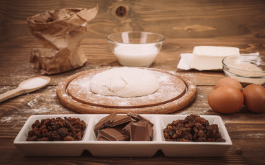 Food ingredients for dough a wooden kitchen board. Cake recipies