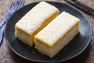 Vanilla slices. Puff pastry filled with vanilla custard topped with fondant icing. 