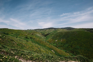 Fototapeta na wymiar Beautiful peaceful green hills on a sunny day in Portugal