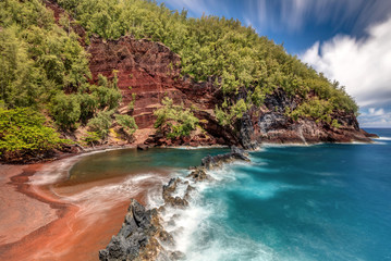 Naklejka na ściany i meble Red Sand Beach in the town of Hana on the tropical Island of Maui, Hawaii