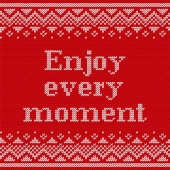 Fototapeta na wymiar Knitting seamless pattern with text Enjoy every moment. Vector. Knit Christmas and new year sweater design. Knitted winter ornaments. Red textured background.