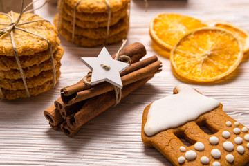 Fototapeta na wymiar Cinnamon sticks and cookies, Christmas concept