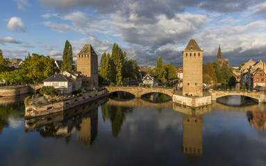 Fototapeta na wymiar Evening panorama of Strasbourg, the medieval bridge, towers and cathedral