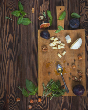 Top view of healthy organic food and kitchen items on wooden background with copy space