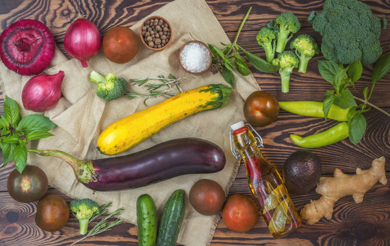 Fresh organic vegetables from the garden on wooden background. Top view Copy space