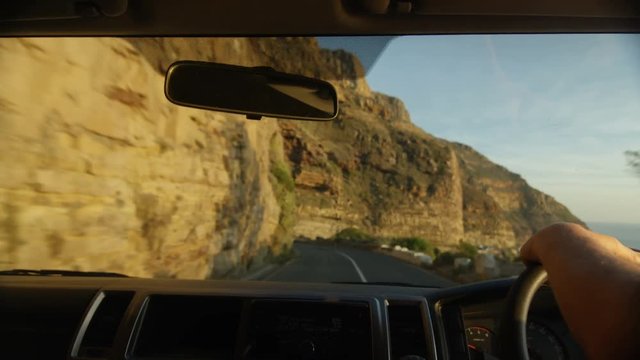 View from inside the vehicle, unidentified driver driving along African coast